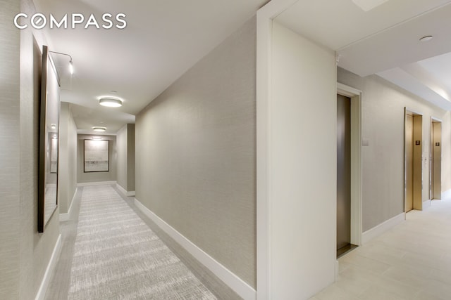 corridor featuring baseboards