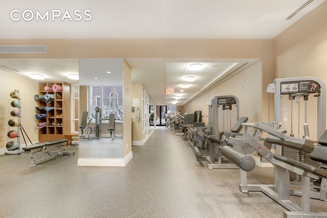 exercise room with visible vents and baseboards