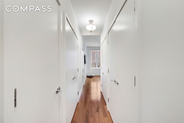 hallway featuring wood finished floors