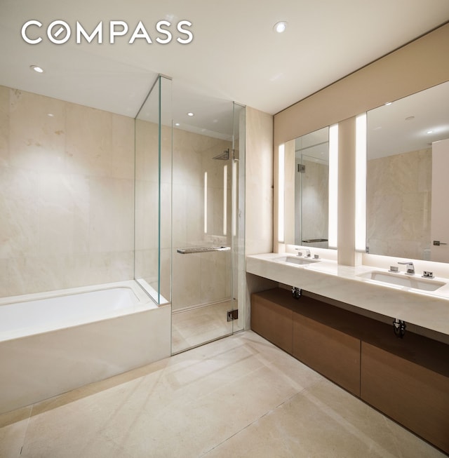 15 Hudson Yards Unit 37F, New York City, NY 10001 - bathroom featuring a sink, a shower stall, recessed lighting, a bath, and double vanity