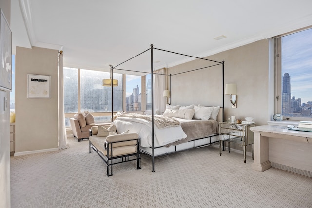 bedroom featuring carpet floors, a view of city, floor to ceiling windows, and crown molding