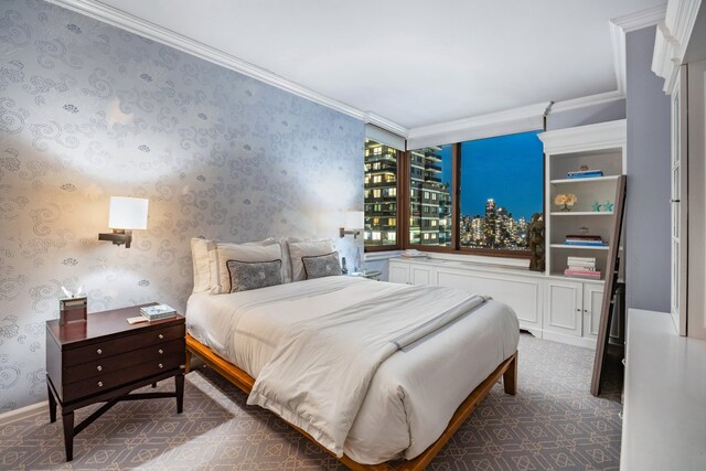 carpeted bedroom featuring crown molding and wallpapered walls