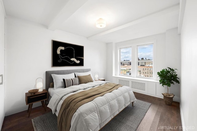 bedroom with beam ceiling and dark hardwood / wood-style floors