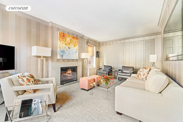 living area featuring ornamental molding, a fireplace with flush hearth, visible vents, and wallpapered walls