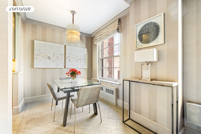 dining space featuring baseboards, ornamental molding, wallpapered walls, radiator heating unit, and an inviting chandelier