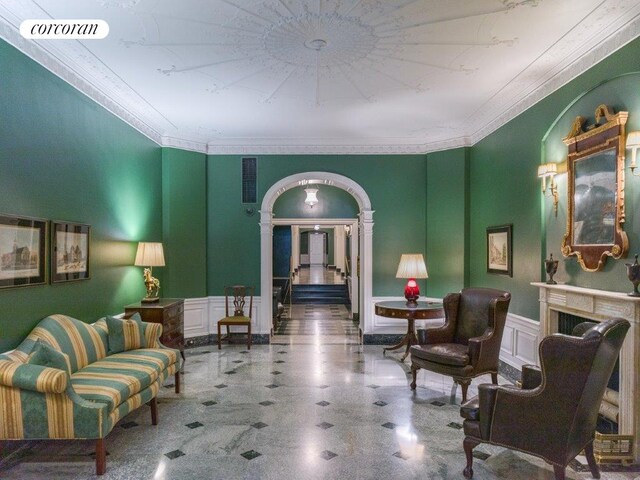 living area with ornamental molding