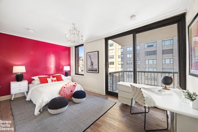 bedroom with wood-type flooring, baseboards, a chandelier, and access to exterior