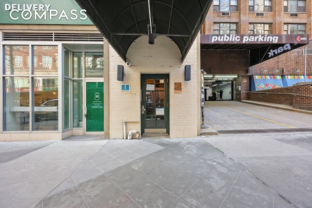 entrance to property with brick siding