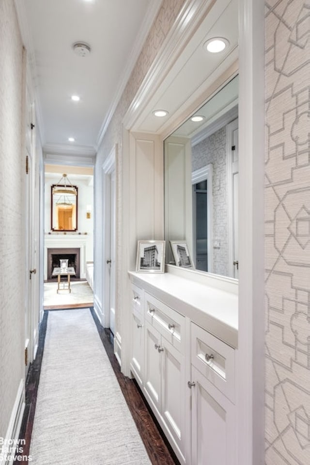 corridor with dark wood-style floors, recessed lighting, and crown molding