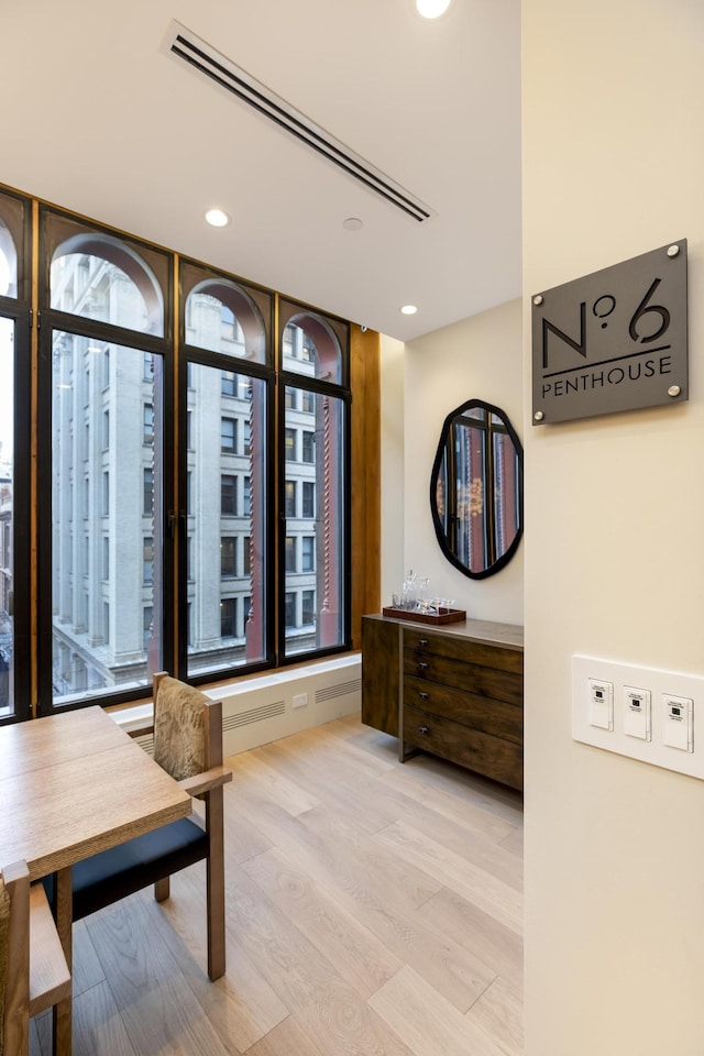 interior space featuring light wood-type flooring, visible vents, and recessed lighting