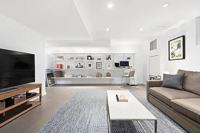 living room with baseboards, tile patterned flooring, visible vents, and recessed lighting