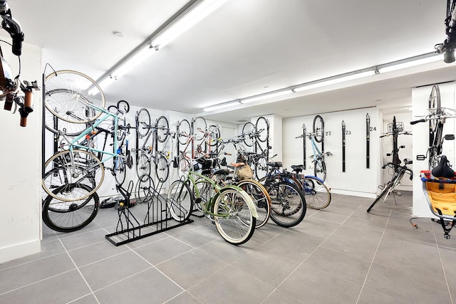 garage featuring baseboards and bike storage