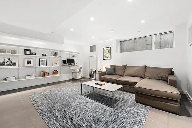 living area featuring recessed lighting, visible vents, and tile patterned floors