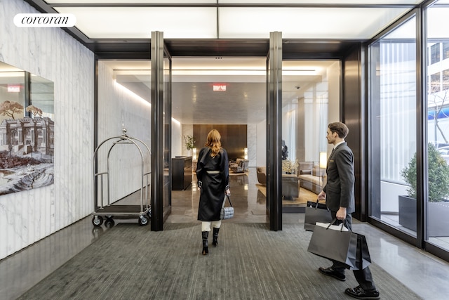 exercise room featuring a wall of windows