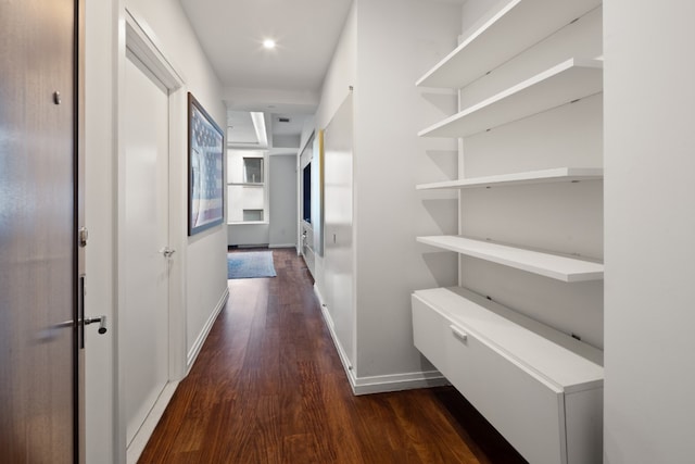 corridor with dark hardwood / wood-style floors