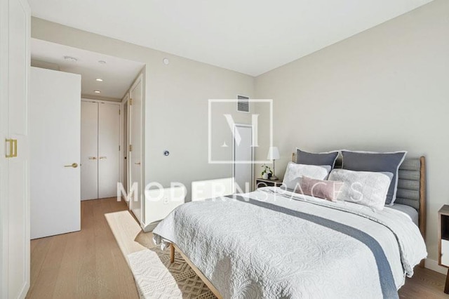 bedroom with wood-type flooring