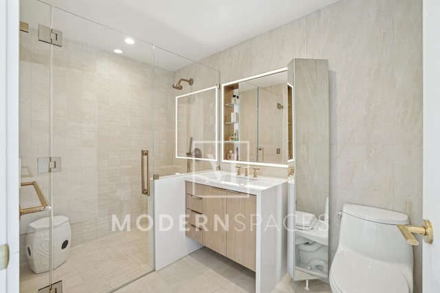 bathroom with vanity, an enclosed shower, and toilet