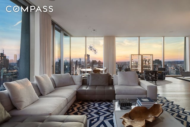 living room featuring hardwood / wood-style flooring, a wealth of natural light, and floor to ceiling windows