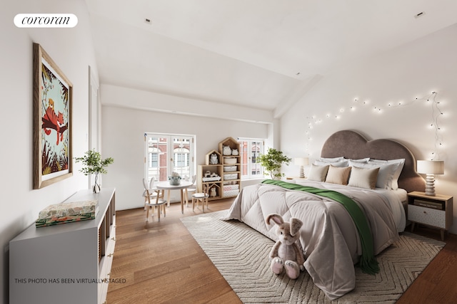 bedroom with lofted ceiling, light wood-style flooring, and visible vents