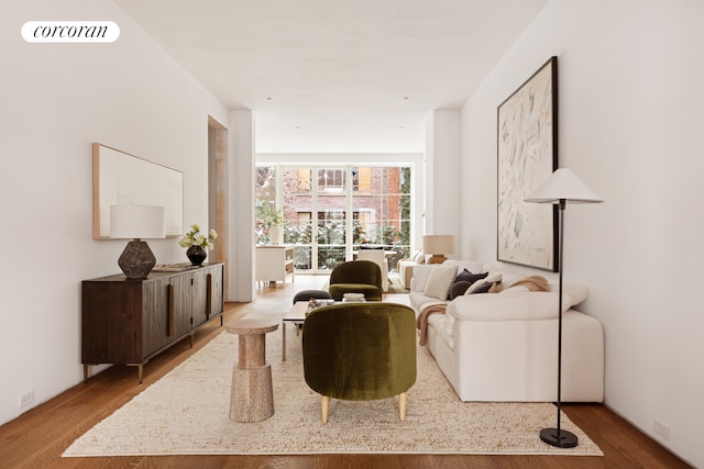 living room with wood finished floors and visible vents