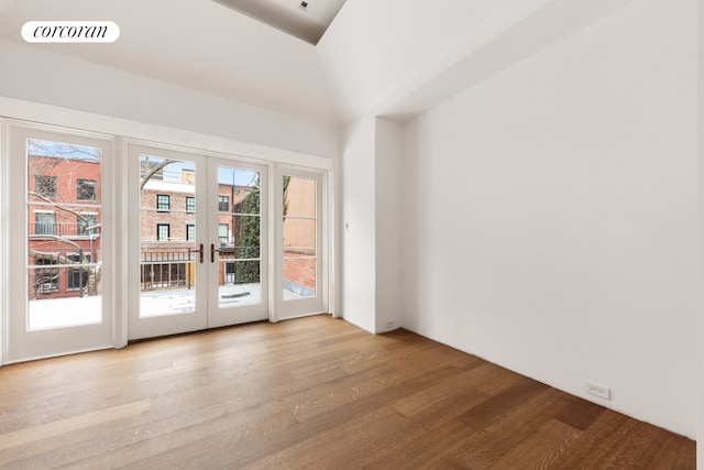 doorway to outside with french doors, plenty of natural light, and light wood-type flooring