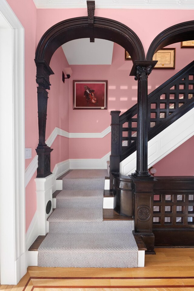 staircase with arched walkways