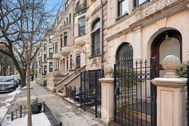 view of building exterior with fence private yard
