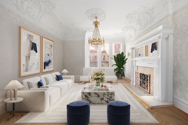 living room with an inviting chandelier, crown molding, wallpapered walls, a premium fireplace, and baseboards