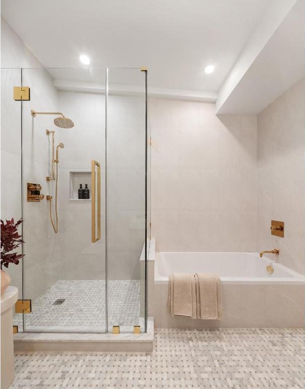 bathroom featuring separate shower and tub