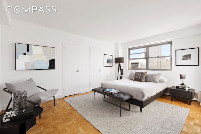 bedroom with light parquet floors