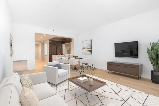 living room with recessed lighting and light wood finished floors