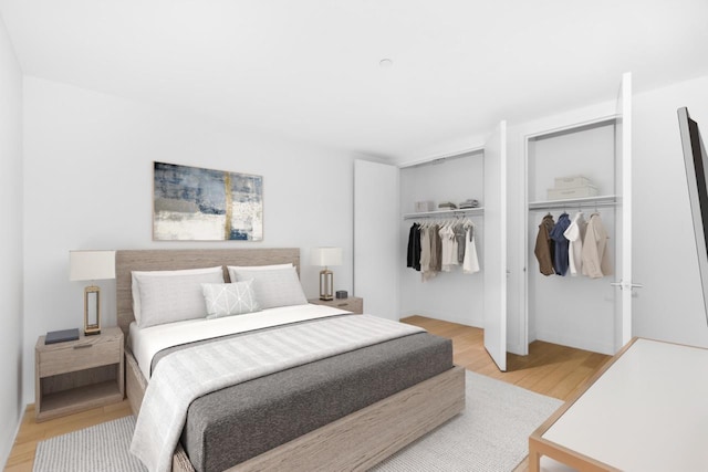 bedroom featuring light wood-style flooring