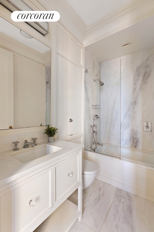 full bathroom featuring vanity, toilet, and tiled shower / bath combo