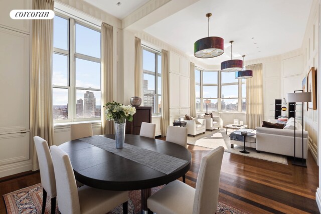 dining space with dark wood-type flooring