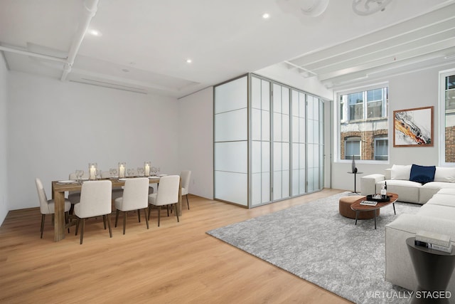 living area with wood finished floors and recessed lighting