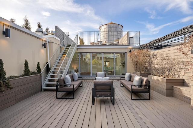 deck with stairs and outdoor lounge area