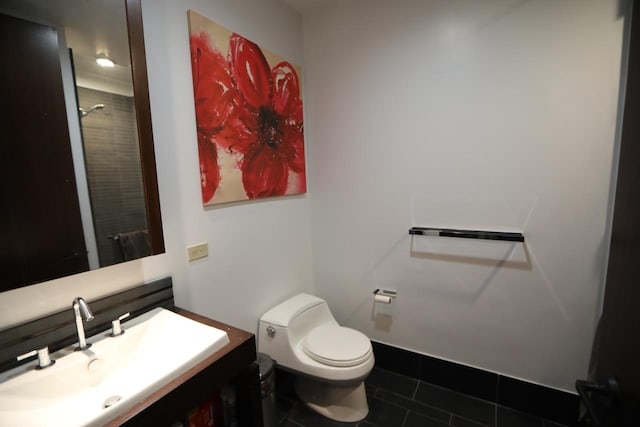 full bath featuring a shower, toilet, vanity, and tile patterned flooring