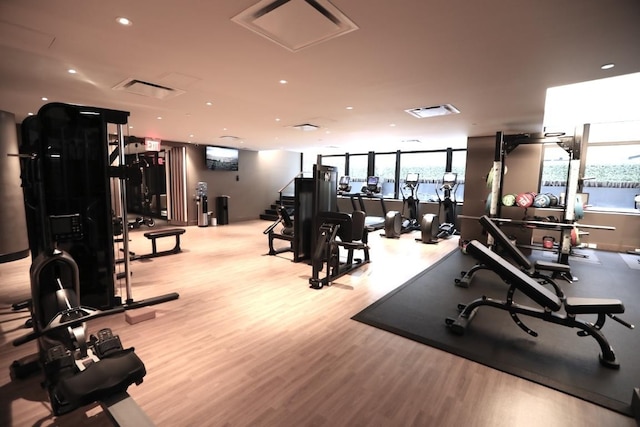 workout area featuring light wood-type flooring