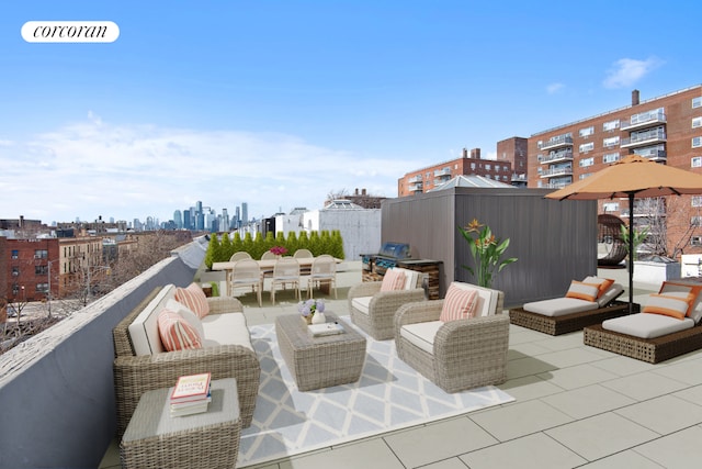 view of patio featuring an outdoor hangout area and a balcony