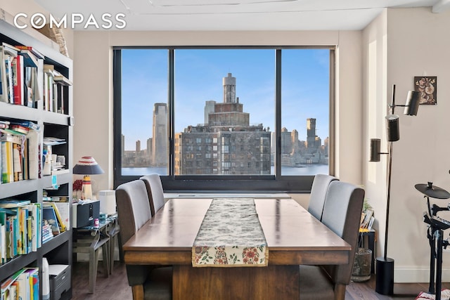 200 Rector Pl Unit 26B, New York City, NY 10280 - dining area featuring wood finished floors, a view of skyline, and an office area