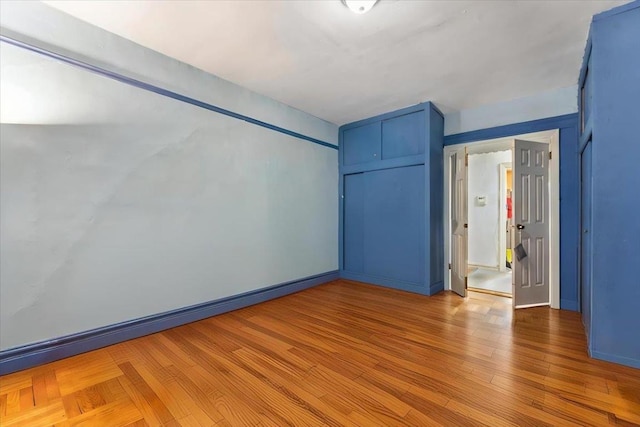 spare room featuring light hardwood / wood-style flooring