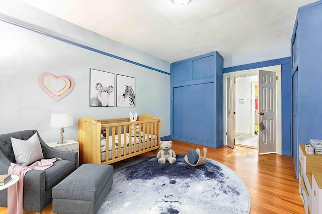 bedroom with light hardwood / wood-style flooring