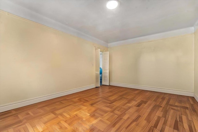 spare room featuring light parquet floors