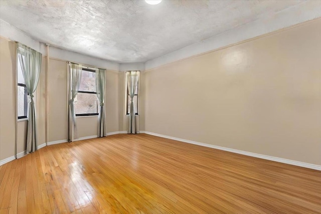 spare room featuring light wood-type flooring