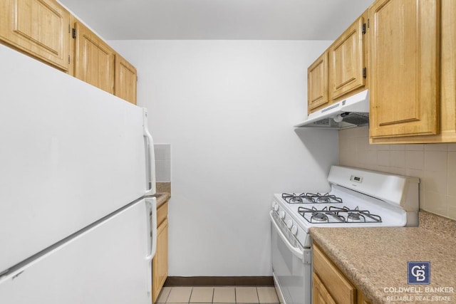 kitchen with light tile patterned flooring, white appliances, light brown cabinetry, and backsplash