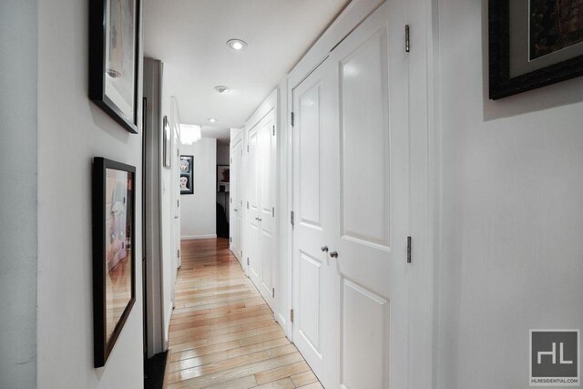 hallway with light wood-type flooring