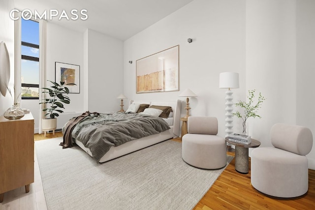 bedroom with wood-type flooring