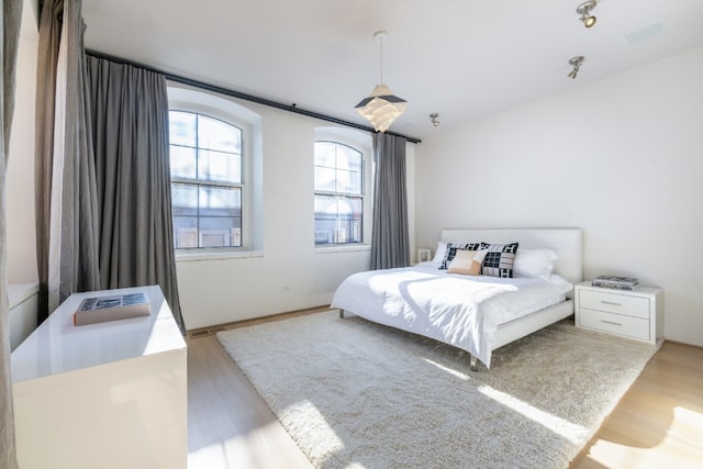 bedroom featuring hardwood / wood-style floors