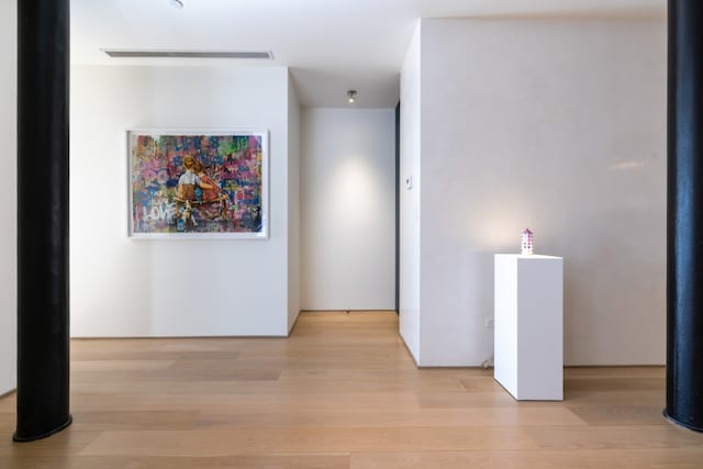 hall featuring light wood finished floors and visible vents