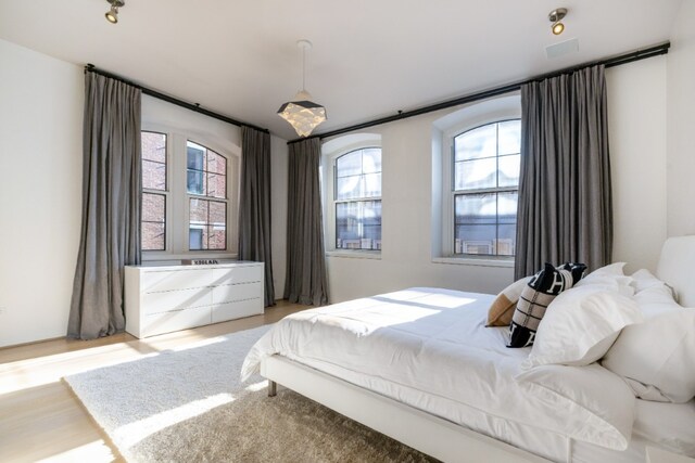 bedroom with light wood-style floors